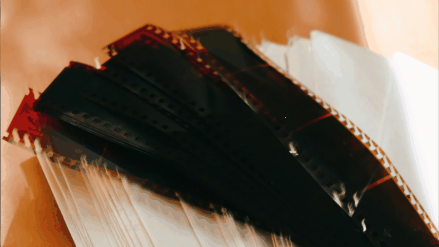 Deteriorating film stock, disorganized media libraries, licensing compliance gaps, CEO reviewing archival chaos